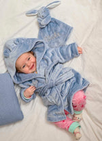 Load image into Gallery viewer, Babies Dusky Blue dressing gown and comforter gift set. This super soft dressing gown and dressing gown is matched in the same fabric with a special personalised touch added to the front of both.
