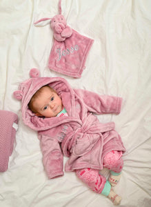 Babies Dusky Pink dressing gown and comforter gift set. This super soft dressing gown and dressing gown is matched in the same fabric with a special personalised touch added to the front of both.