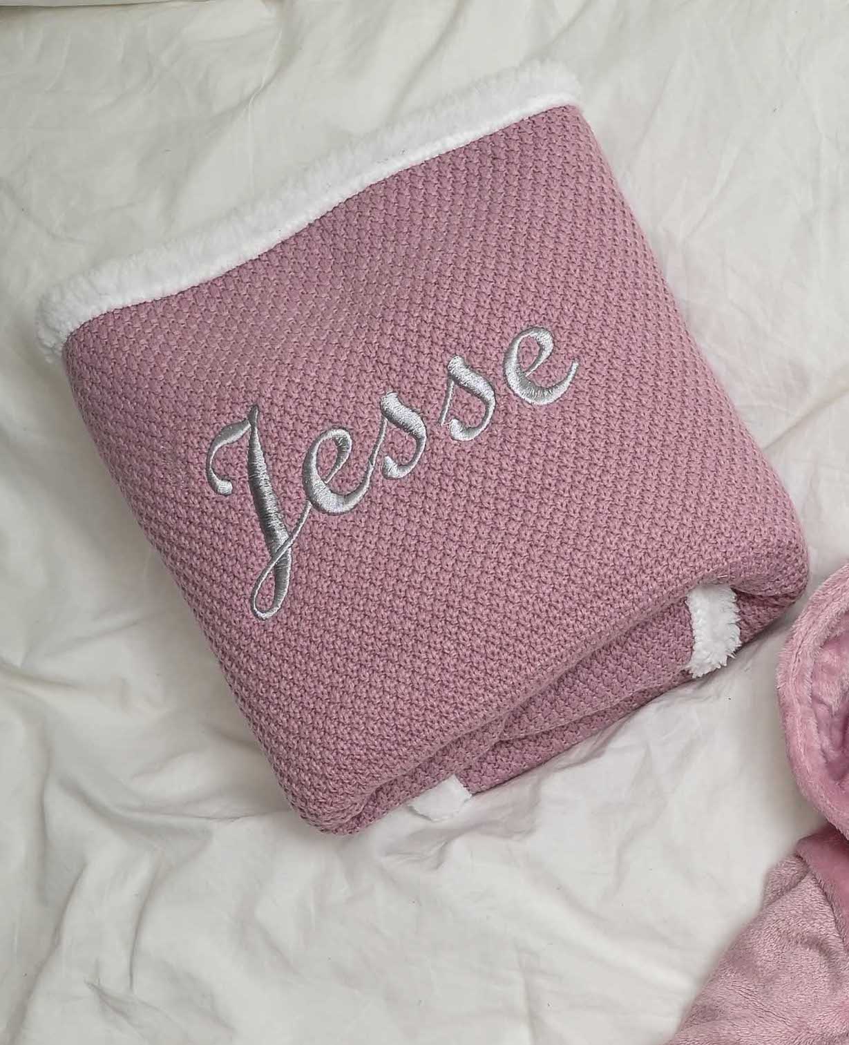 Babies Dusky Pink knitted blanket is super soft and thick, perfect for keeping your little one warm and cosy. With a sherpa lining to the back and embroidered personalisation to the front. Size 75x90cm.