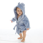  Babies personalised Dusky Blue hooded dressing gown. Made from super soft material, it features an elephant embroidery to the chest as well as detailing pom pom ears and a hood. Make it extra special by adding a personalised touch.