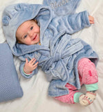 Load image into Gallery viewer,  Babies personalised Dusky Blue hooded dressing gown. Made from super soft material, it features an elephant embroidery to the chest as well as detailing pom pom ears and a hood. Make it extra special by adding a personalised touch.
