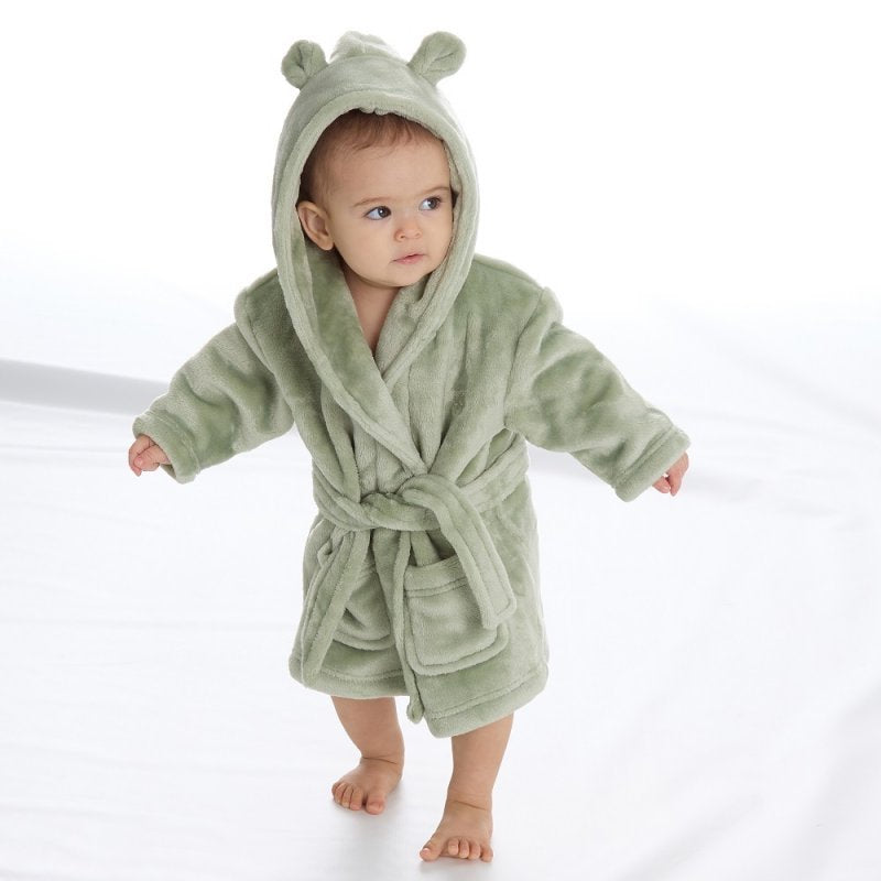  Babies personalised Green hooded dressing gown. Made from super soft material, it features an elephant embroidery to the chest as well as detailing pom pom ears and a hood. Make it extra special by adding a personalised touch.