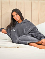 This ladies Charcoal long line over sizes hoody is made from a luxurious heavy weight bonded fabric and is fully borg lines throughout the entire hoody- making it a winter essential. With a hood, kangaroo pocket to the front and your personalised name embroidered to the chest.