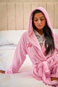 This ladies personalised dressing gown in Light Pink is made out of a luxurious, plush, super soft fabric, perfect for keeping you warm on a cold day. This dressing gown has a hood to the back, pockets on either side and a tie around the waist. This dressing gown can be personalised with any name you wish, for special requests please leave this in the notes section of your order. This will be embroidered. You can select the colour of the thread this will be personalised in.