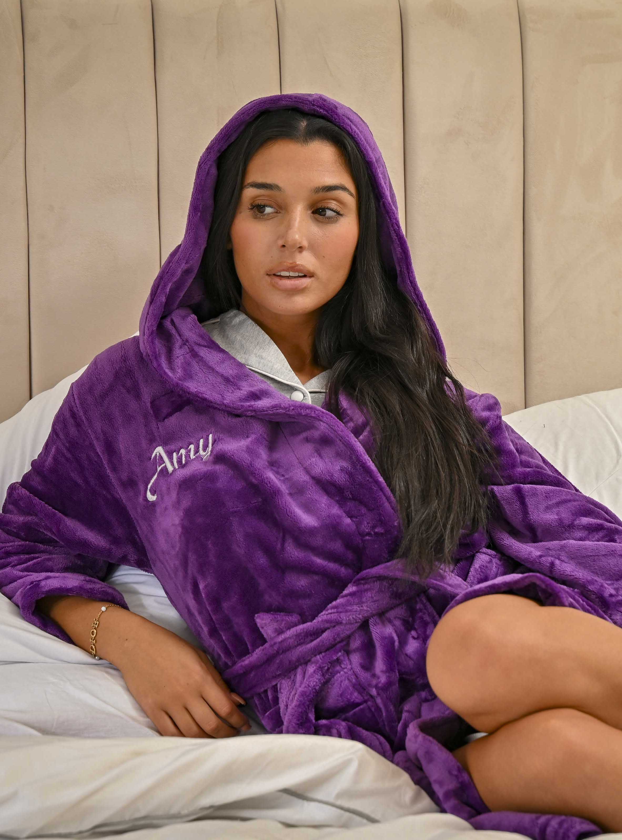 This ladies personalised dressing gown in Dark Purple is made out of a luxurious, plush, super soft fabric, perfect for keeping you warm on a cold day. This dressing gown has a hood to the back, pockets on either side and a tie around the waist. This dressing gown can be personalised with any name you wish, for special requests please leave this in the notes section of your order. This will be embroidered. You can select the colour of the thread this will be personalised in.