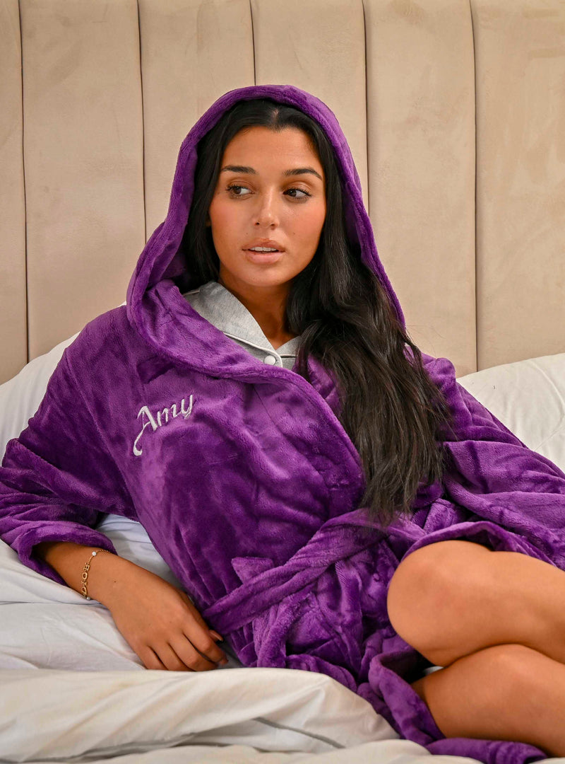 This ladies personalised dressing gown in Dark Purple is made out of a luxurious, plush, super soft fabric, perfect for keeping you warm on a cold day. This dressing gown has a hood to the back, pockets on either side and a tie around the waist. This dressing gown can be personalised with any name you wish, for special requests please leave this in the notes section of your order. This will be embroidered. You can select the colour of the thread this will be personalised in.