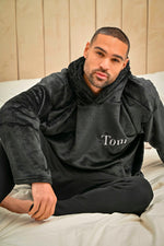 Load image into Gallery viewer, This mens Black over sized hoodie made from a super plush fabric with a Black borg lined hood for extra warmth. With a hood to the back and a kangaroo pocket to the front. Complete with your name embroidered to the chest. 
